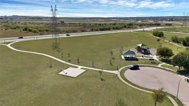an aerial view of a house with a swimming pool