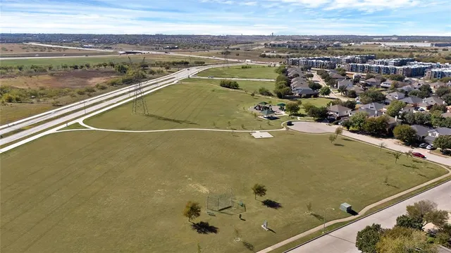 an aerial view of a house with a lake view