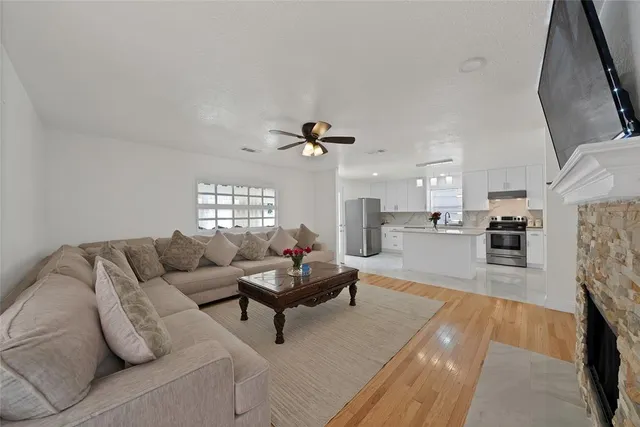 a living room with furniture and a fireplace
