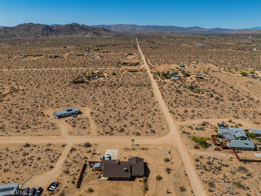 60119 Sunny Sands Drive Joshua Tree, CA 92252 - Photo 2 of 21 a view of lake and mountain