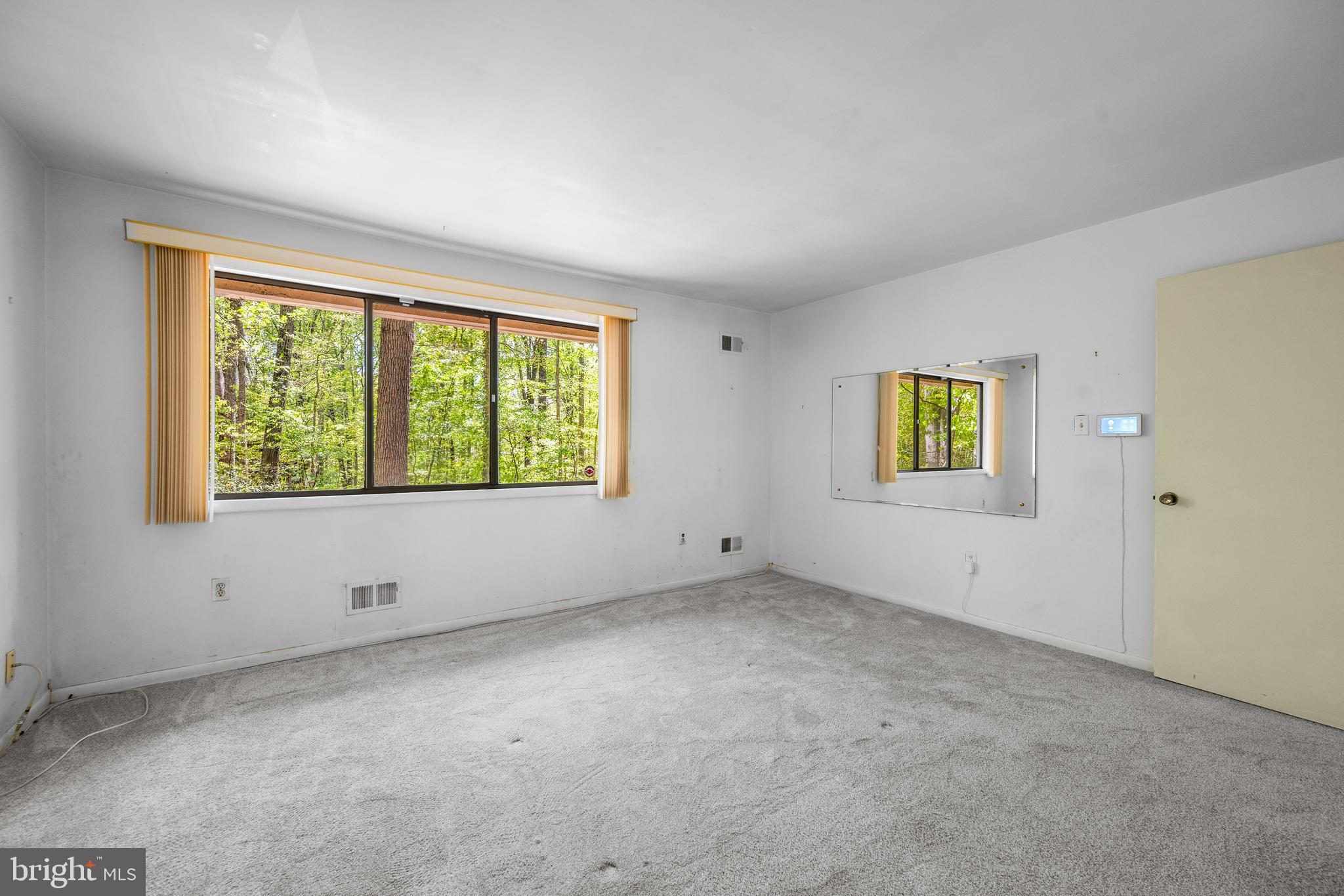 11002 Swansfield Road Columbia, MD 21044 - Photo 11 of 23 an empty room with a window