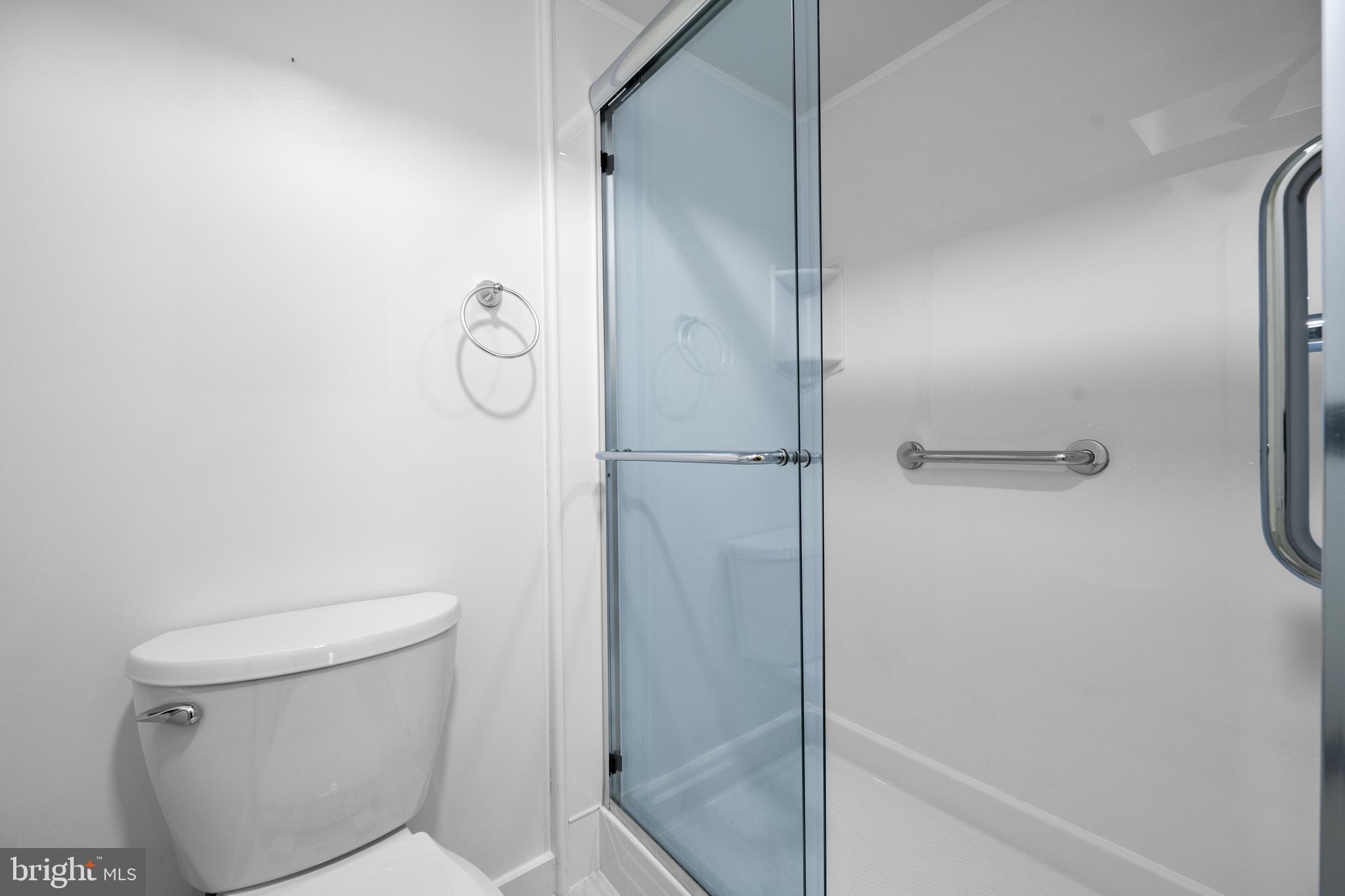 11002 Swansfield Road Columbia, MD 21044 - Photo 14 of 23 a bathroom with a shower and toilet