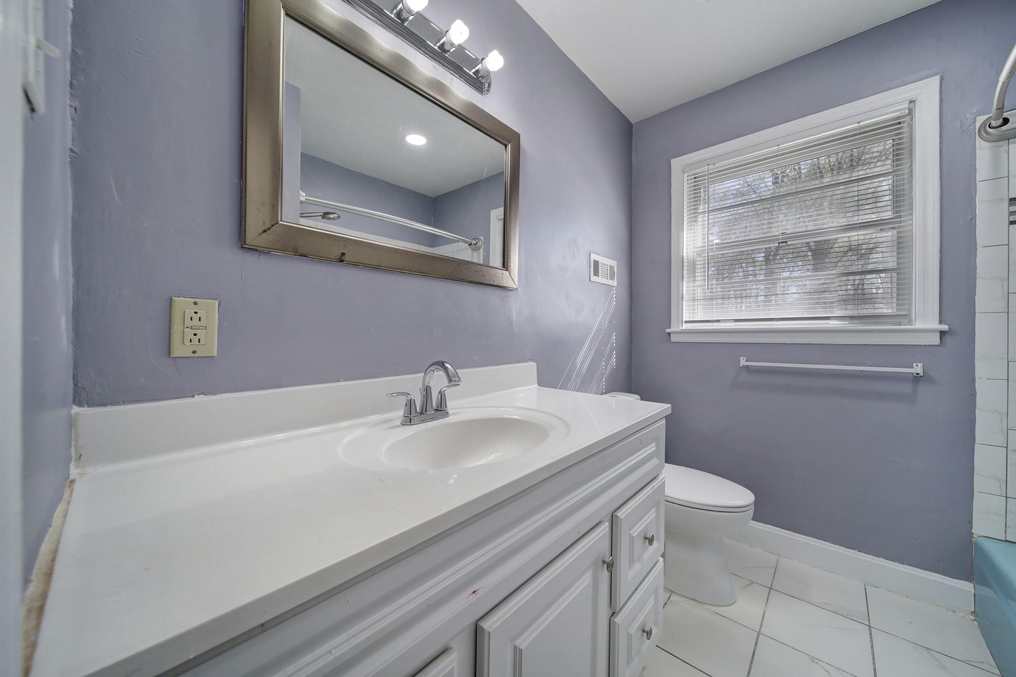 6425 Springfield Drive Charlotte, NC 28212 - Photo 12 of 37 a bathroom with a sink a vanity and a toilet