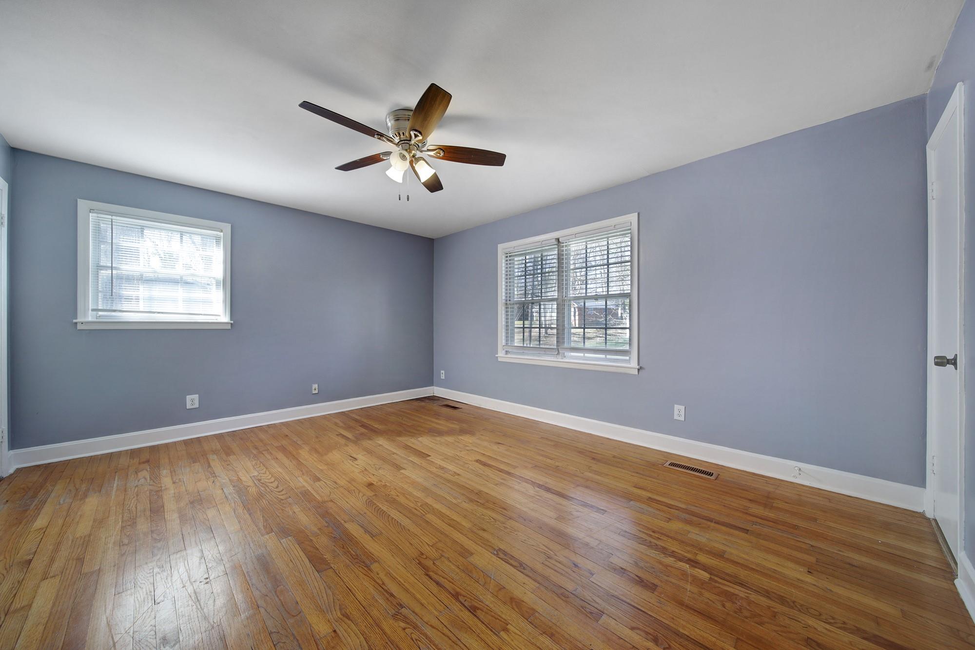 6425 Springfield Drive Charlotte, NC 28212 - Photo 20 of 37 a view of an empty room with a window and wooden floor