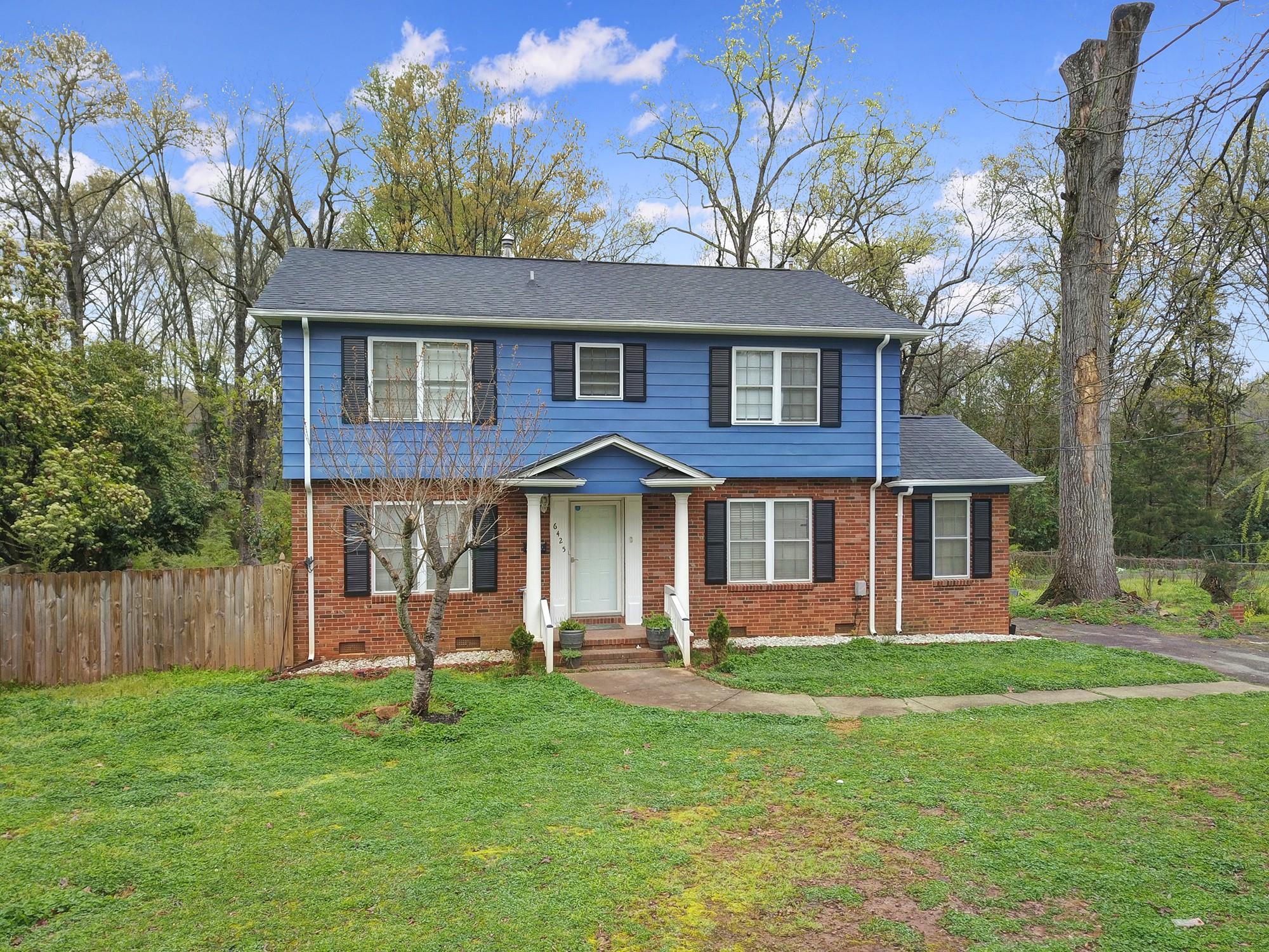 6425 Springfield Drive Charlotte, NC 28212 - Photo 2 of 37 a front view of a house with a yard