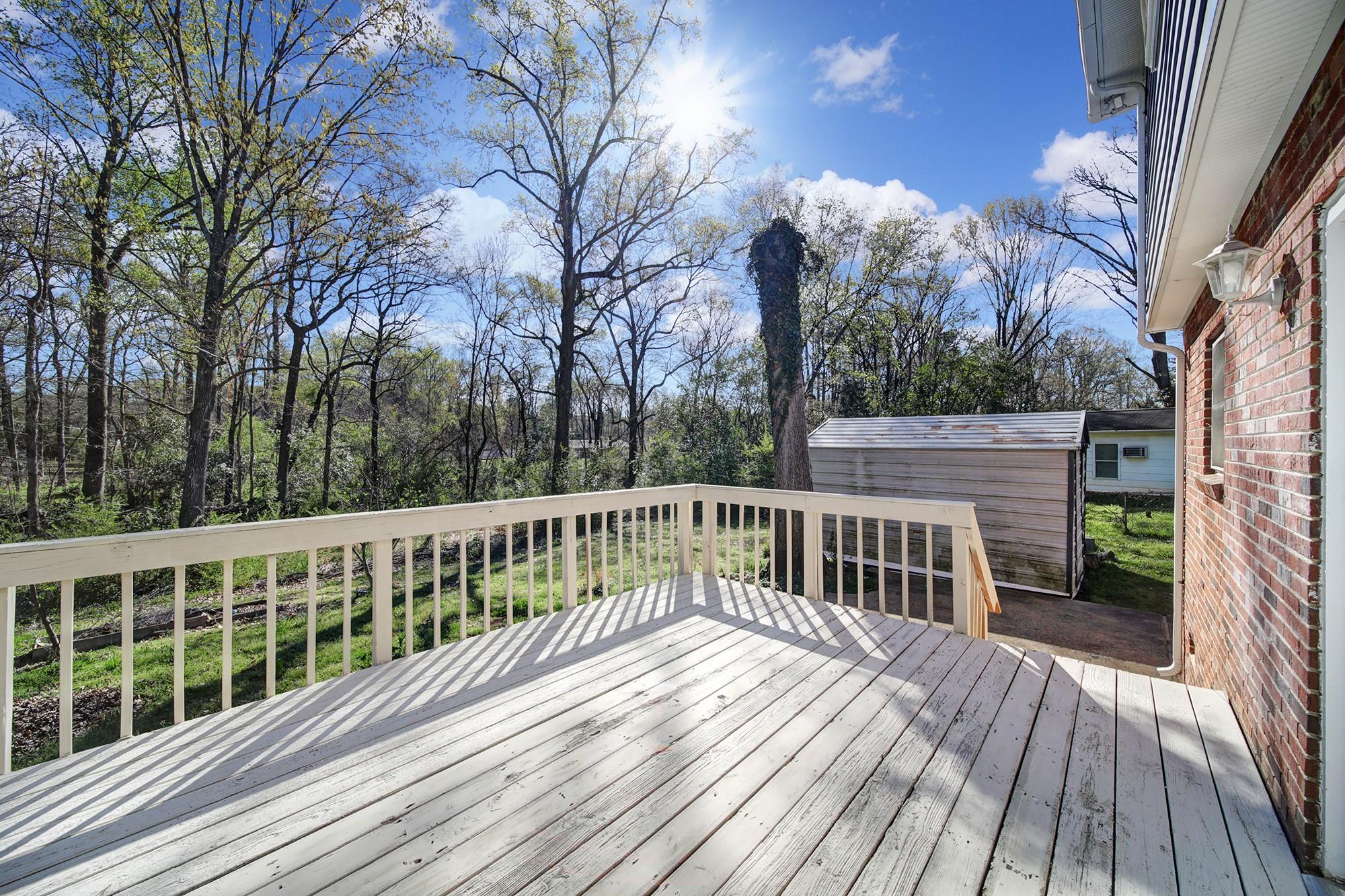 6425 Springfield Drive Charlotte, NC 28212 - Photo 28 of 37 a view of balcony with wooden floor and fence