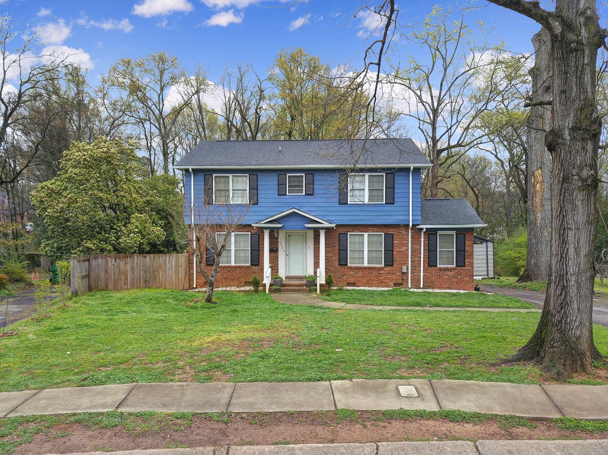 6425 Springfield Drive Charlotte, NC 28212 - Photo 31 of 37 a view of a brick house with a yard