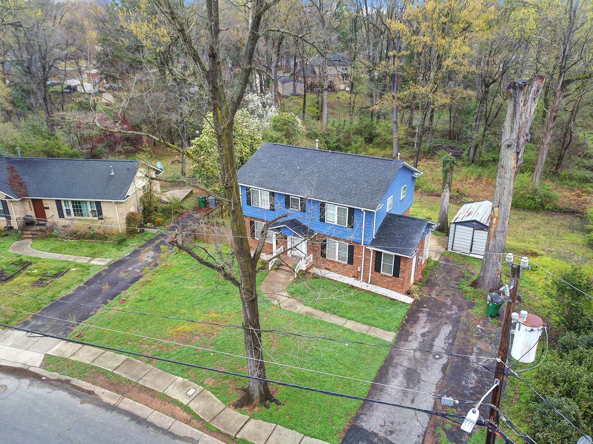 6425 Springfield Drive Charlotte, NC 28212 - Photo 33 of 37 a aerial view of a house with a yard table and chairs