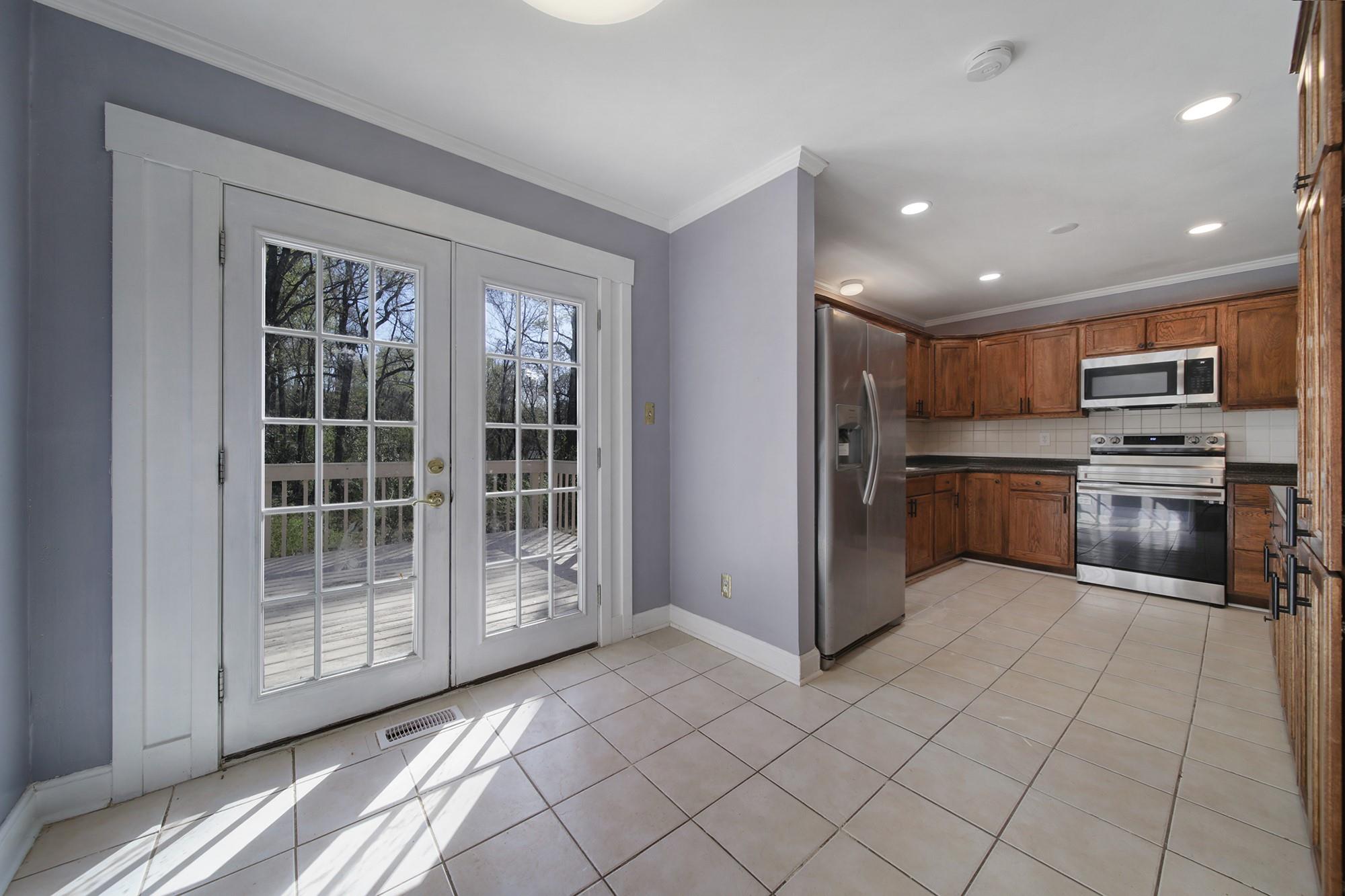 6425 Springfield Drive Charlotte, NC 28212 - Photo 7 of 37 a kitchen with stainless steel appliances granite countertop a refrigerator and a stove top oven