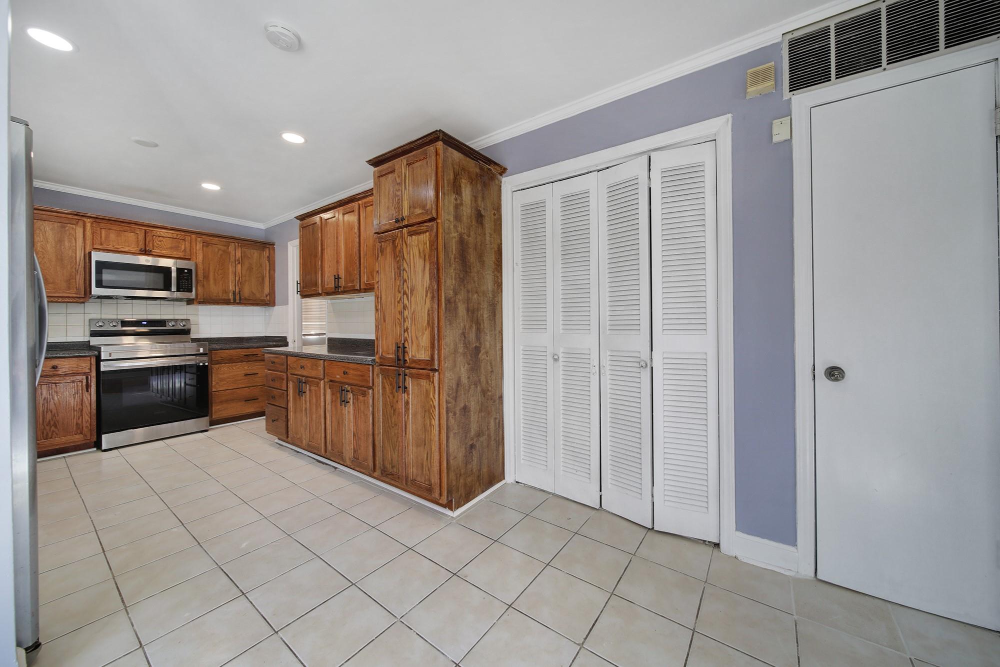 6425 Springfield Drive Charlotte, NC 28212 - Photo 8 of 37 a kitchen with stainless steel appliances granite countertop a refrigerator and a sink