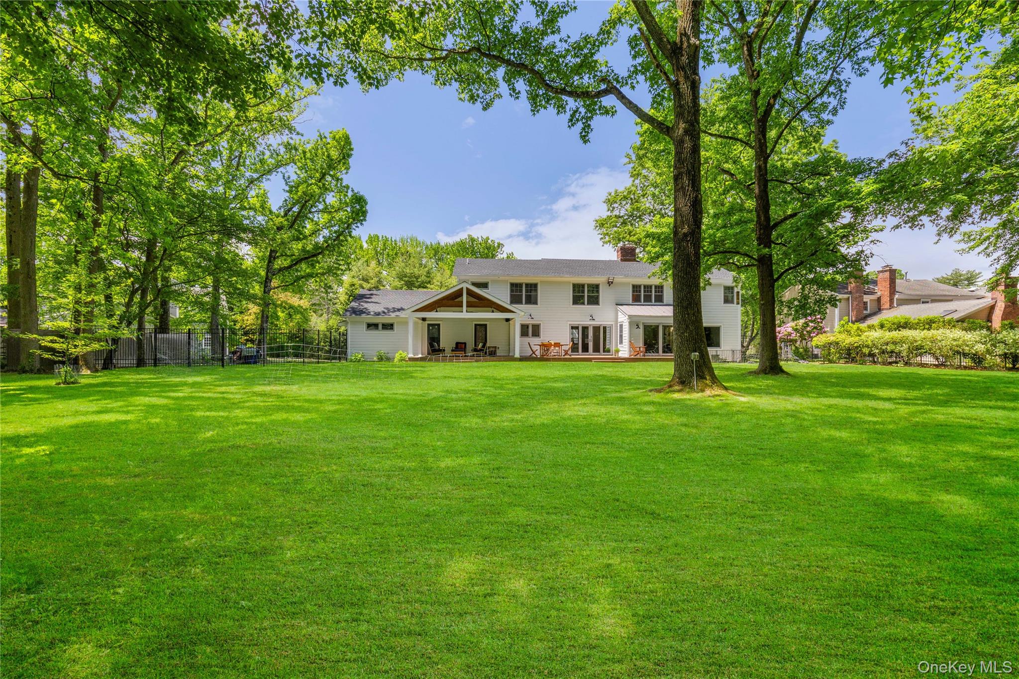 19 John Jay Place Rye, NY 10580 - Photo 2 of 45 The half of an acre property is a verdant and peaceful oasis conducive to play, entertainment and relaxation.