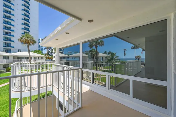 a view of balcony with furniture