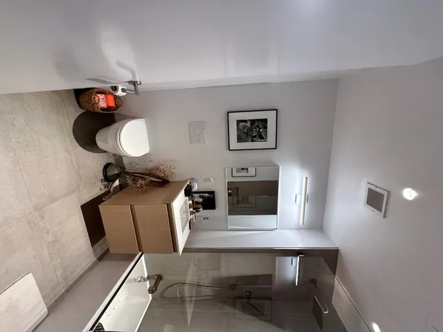 a living room with furniture and a chair