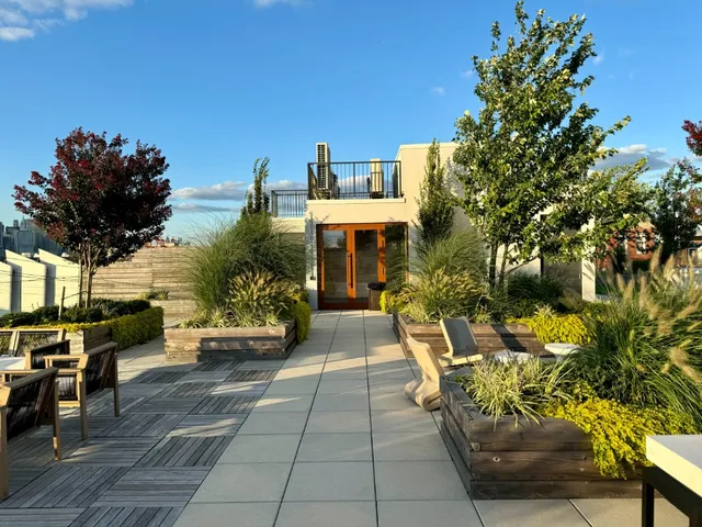 a view of a patio with table and chairs and potted plants