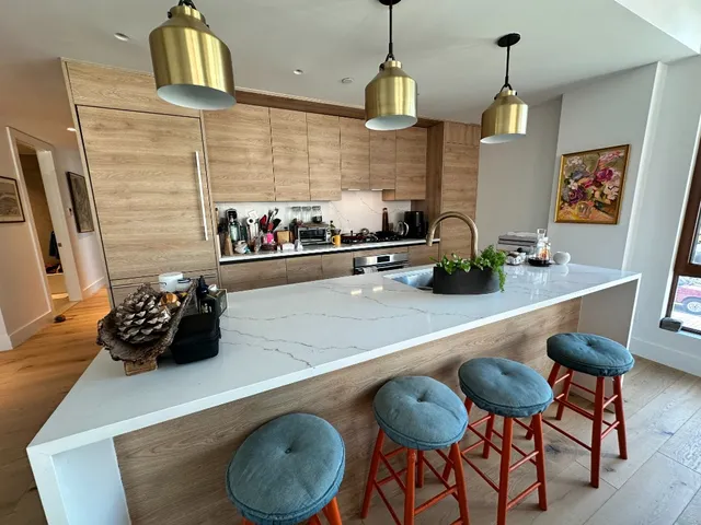 a kitchen with a sink cabinets and window