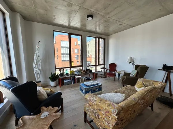a living room with furniture and a large window