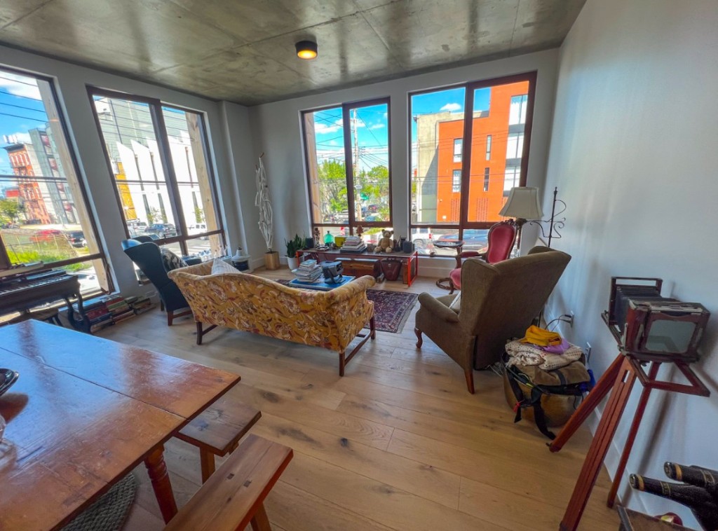 189 Conover Street, Unit 2A Brooklyn, NY 11231 - Photo 6 of 27 a living room with furniture and floor to ceiling windows