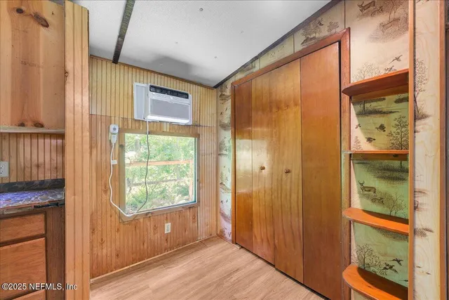 a view of an entryway with a door