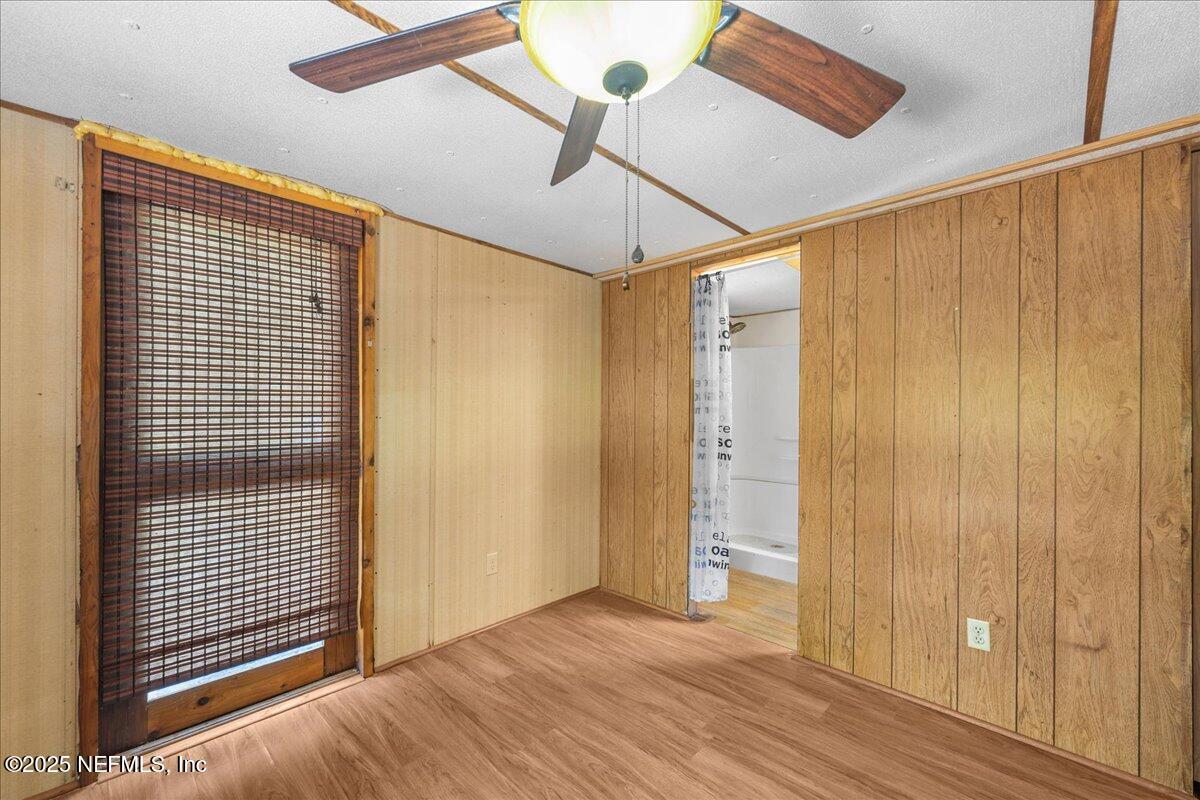 506 Cedar Creek Road, Unit 1 Palatka, FL 32177 - Photo 23 of 49 a view of a room with wooden floor and windows