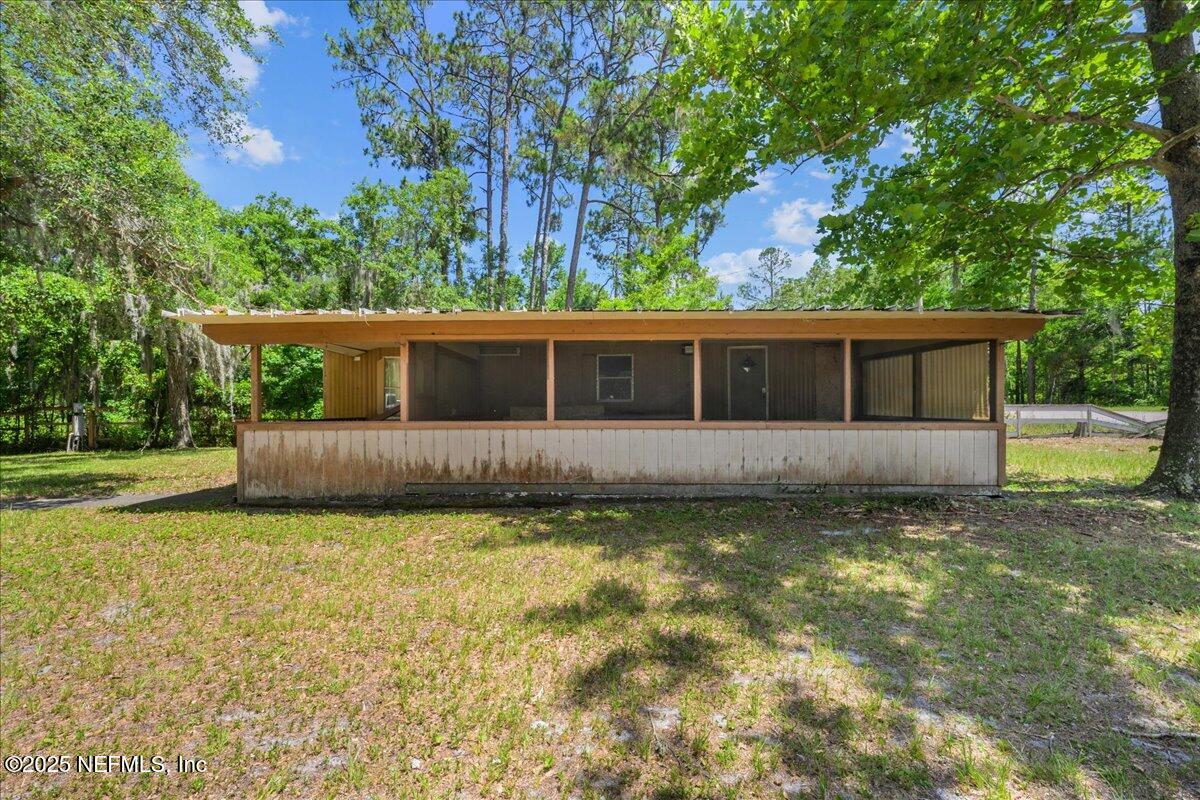 506 Cedar Creek Road, Unit 1 Palatka, FL 32177 - Photo 25 of 49 a view of a house with a yard