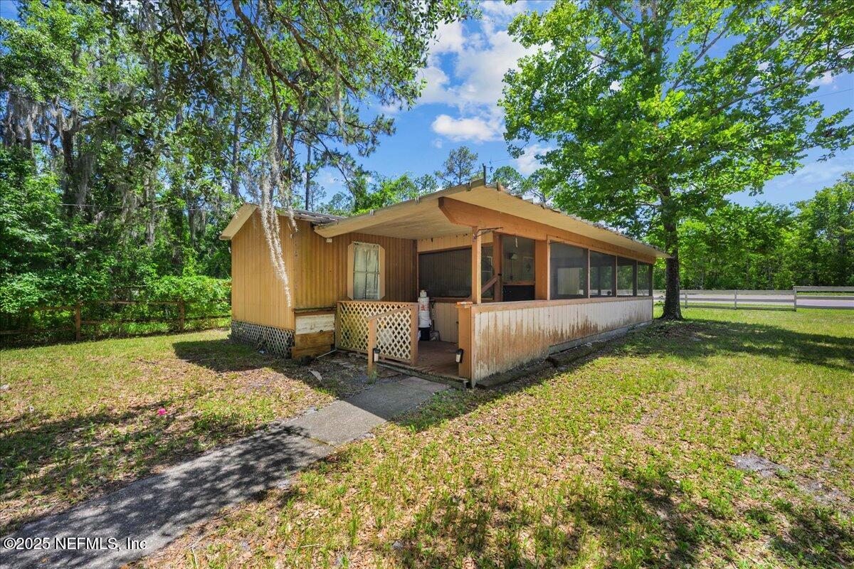 506 Cedar Creek Road, Unit 1 Palatka, FL 32177 - Photo 26 of 49 a view of a house with a yard
