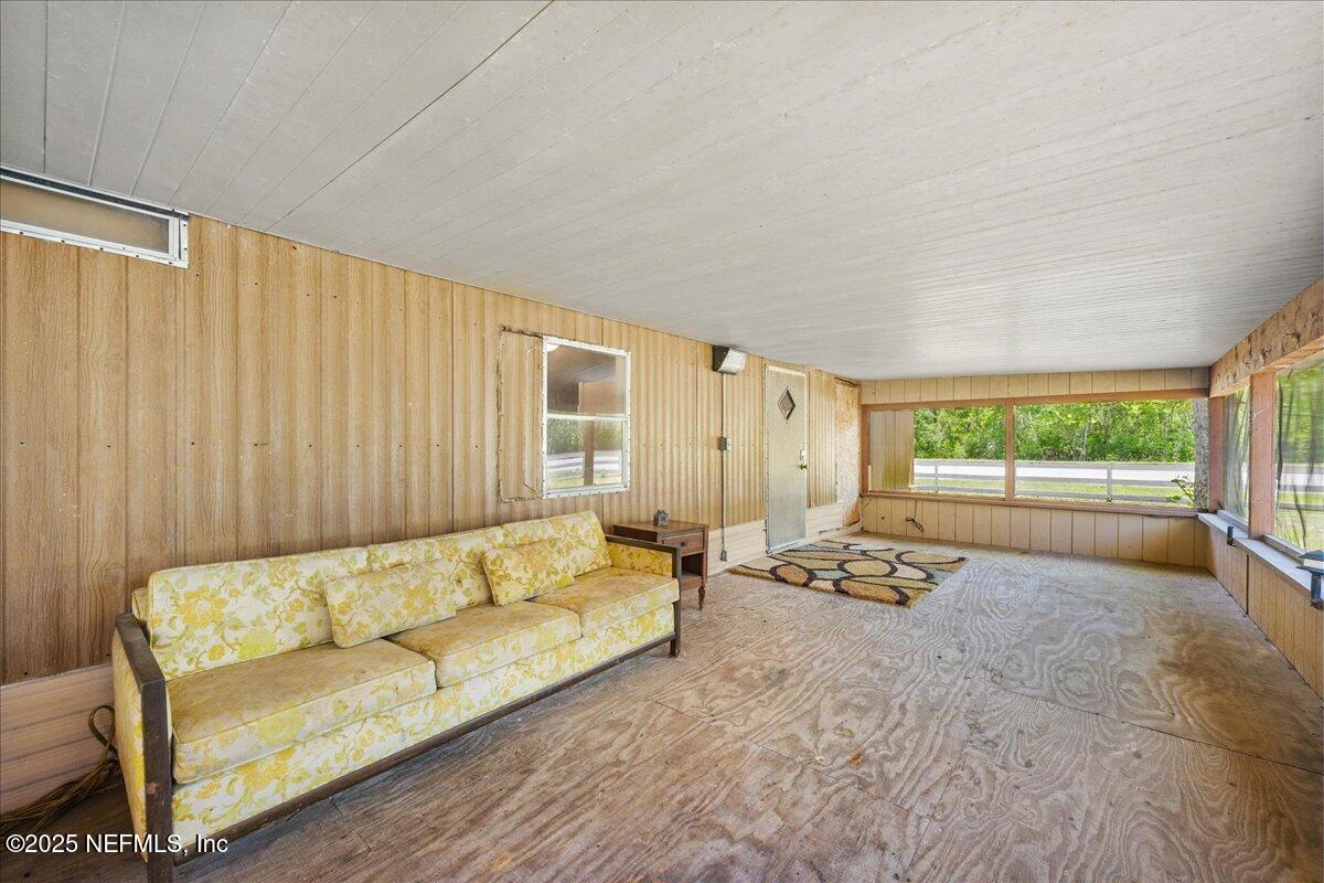 506 Cedar Creek Road, Unit 1 Palatka, FL 32177 - Photo 28 of 49 a living room with furniture and a large window
