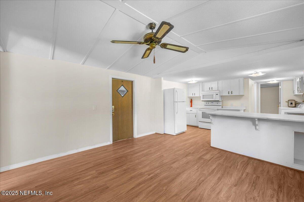 506 Cedar Creek Road, Unit 1 Palatka, FL 32177 - Photo 32 of 49 a view of a kitchen with wooden floor