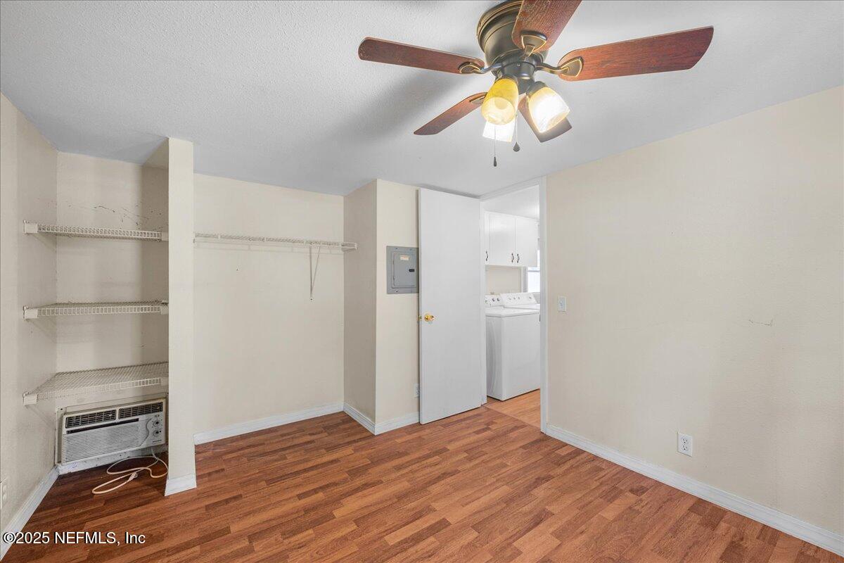 506 Cedar Creek Road, Unit 1 Palatka, FL 32177 - Photo 35 of 49 a view of empty room with wooden floor and fan