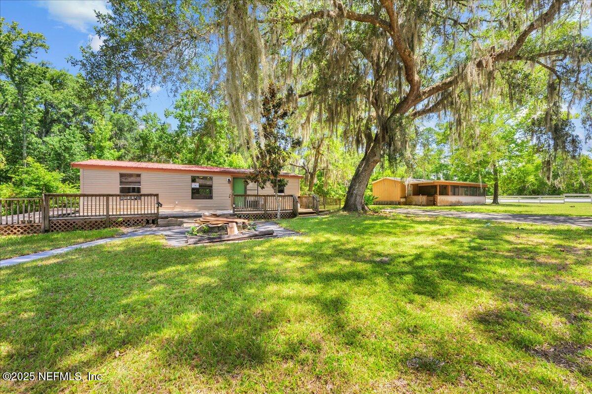 506 Cedar Creek Road, Unit 1 Palatka, FL 32177 - Photo 5 of 49 a view of a house with backyard and sitting area