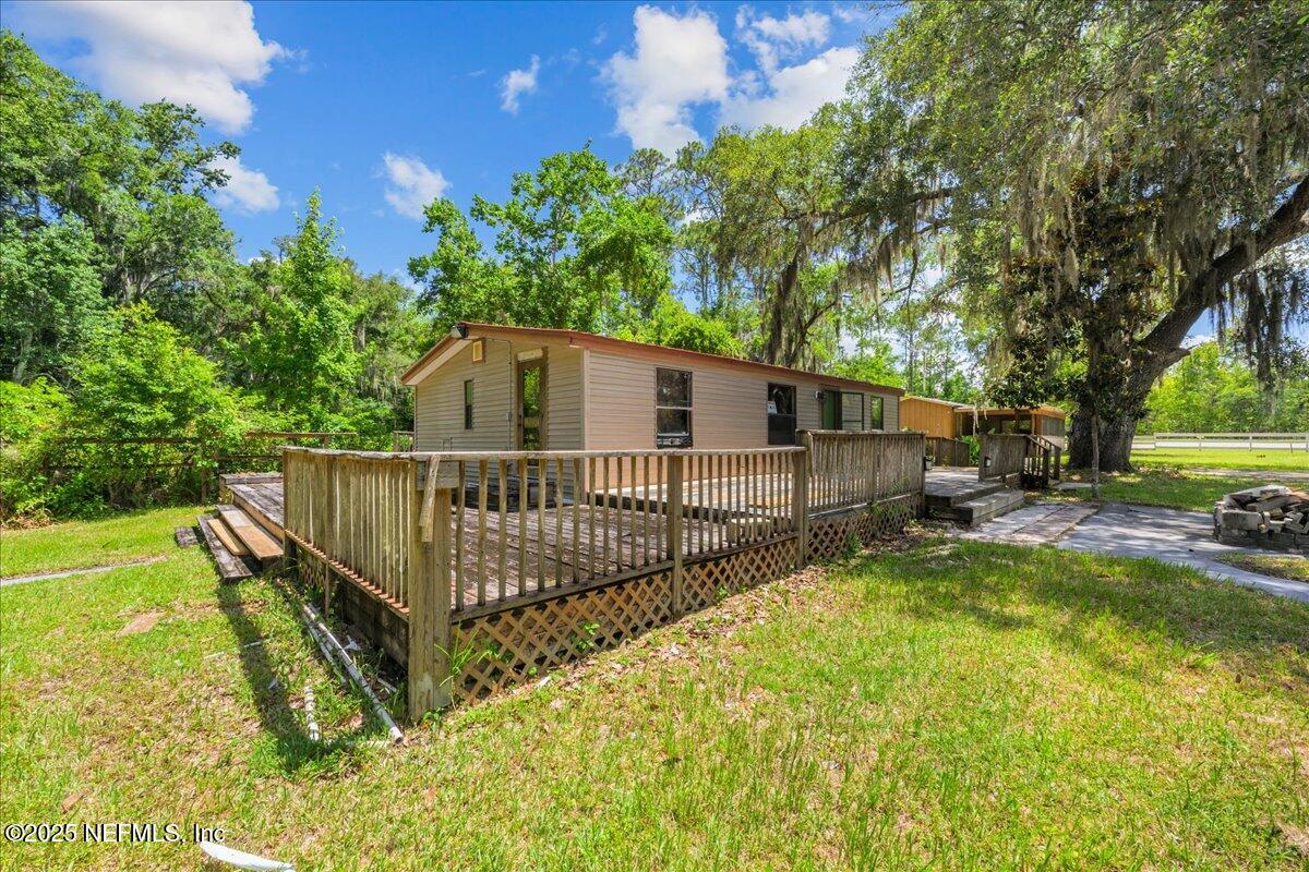 506 Cedar Creek Road, Unit 1 Palatka, FL 32177 - Photo 6 of 49 a view of a house with backyard and sitting area