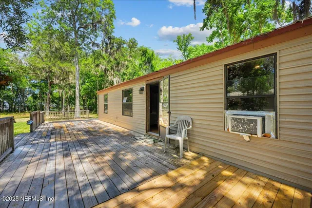 a view of a backyard with sitting area