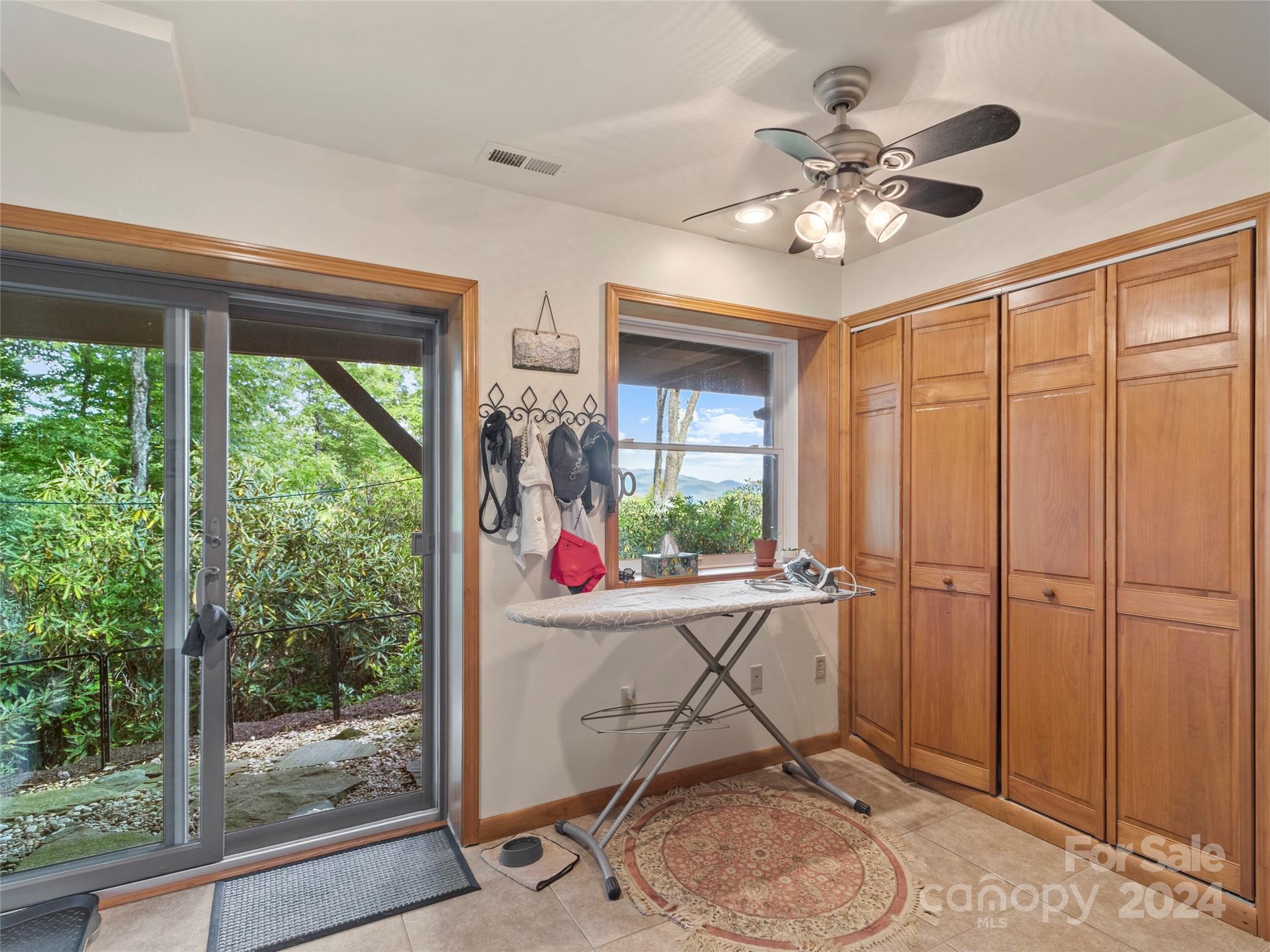 30 Pinkerton Corner Fairview, NC 28730 - Photo 20 of 31 a room with furniture and large windows
