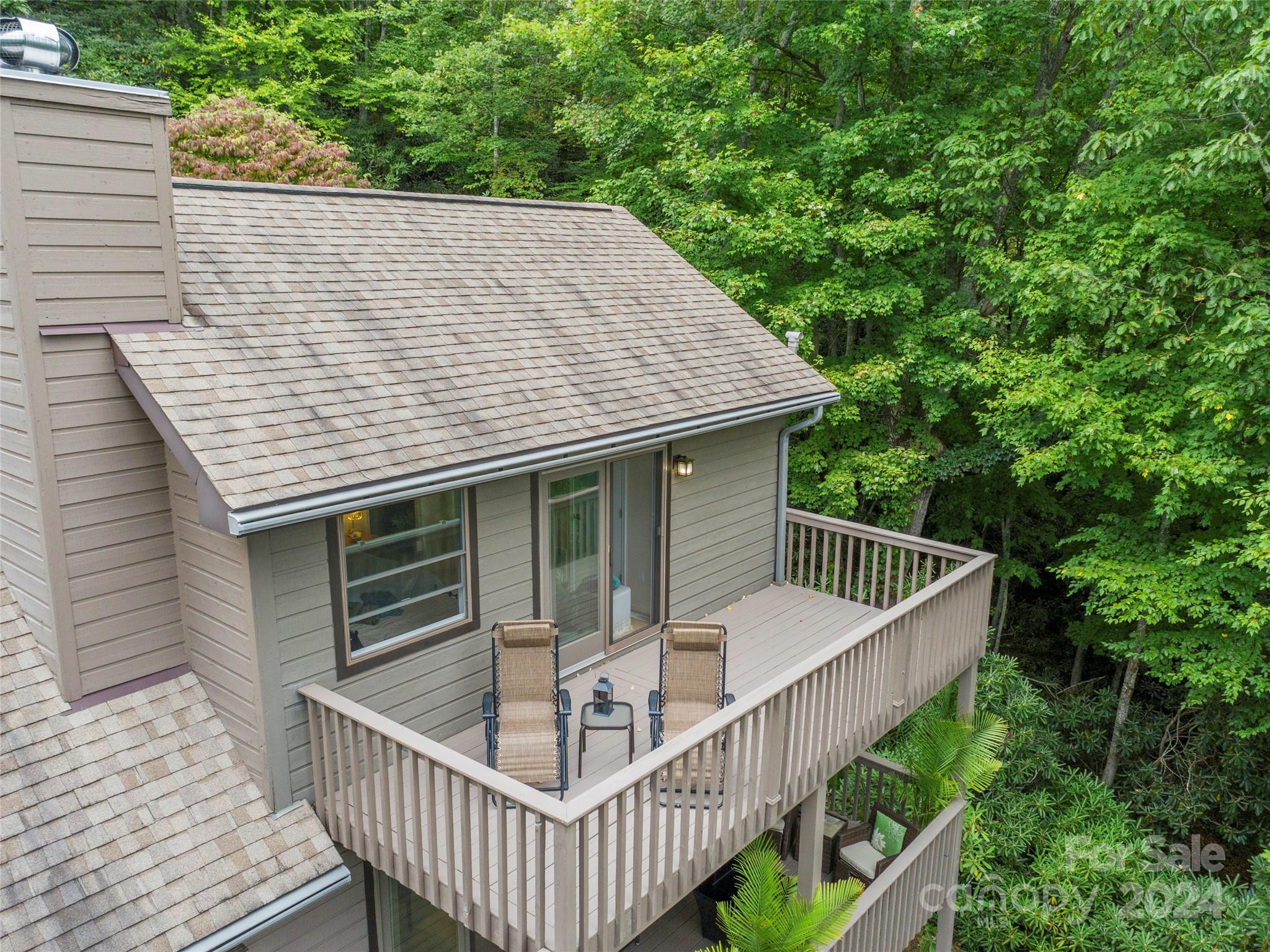 30 Pinkerton Corner Fairview, NC 28730 - Photo 22 of 31 a view of a wooden deck and a backyard
