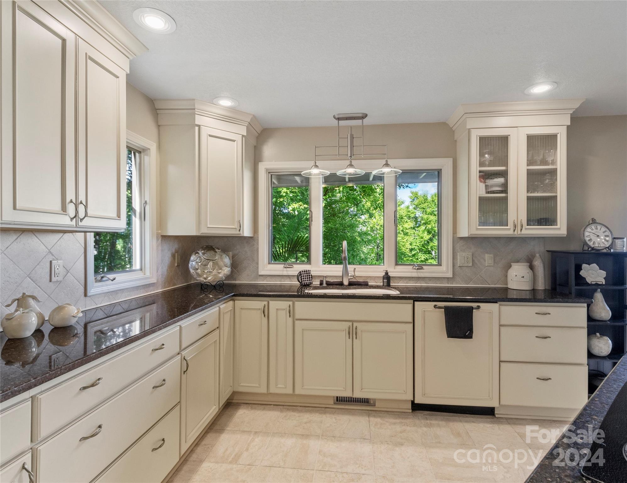 30 Pinkerton Corner Fairview, NC 28730 - Photo 9 of 31 a kitchen with a sink stove and window