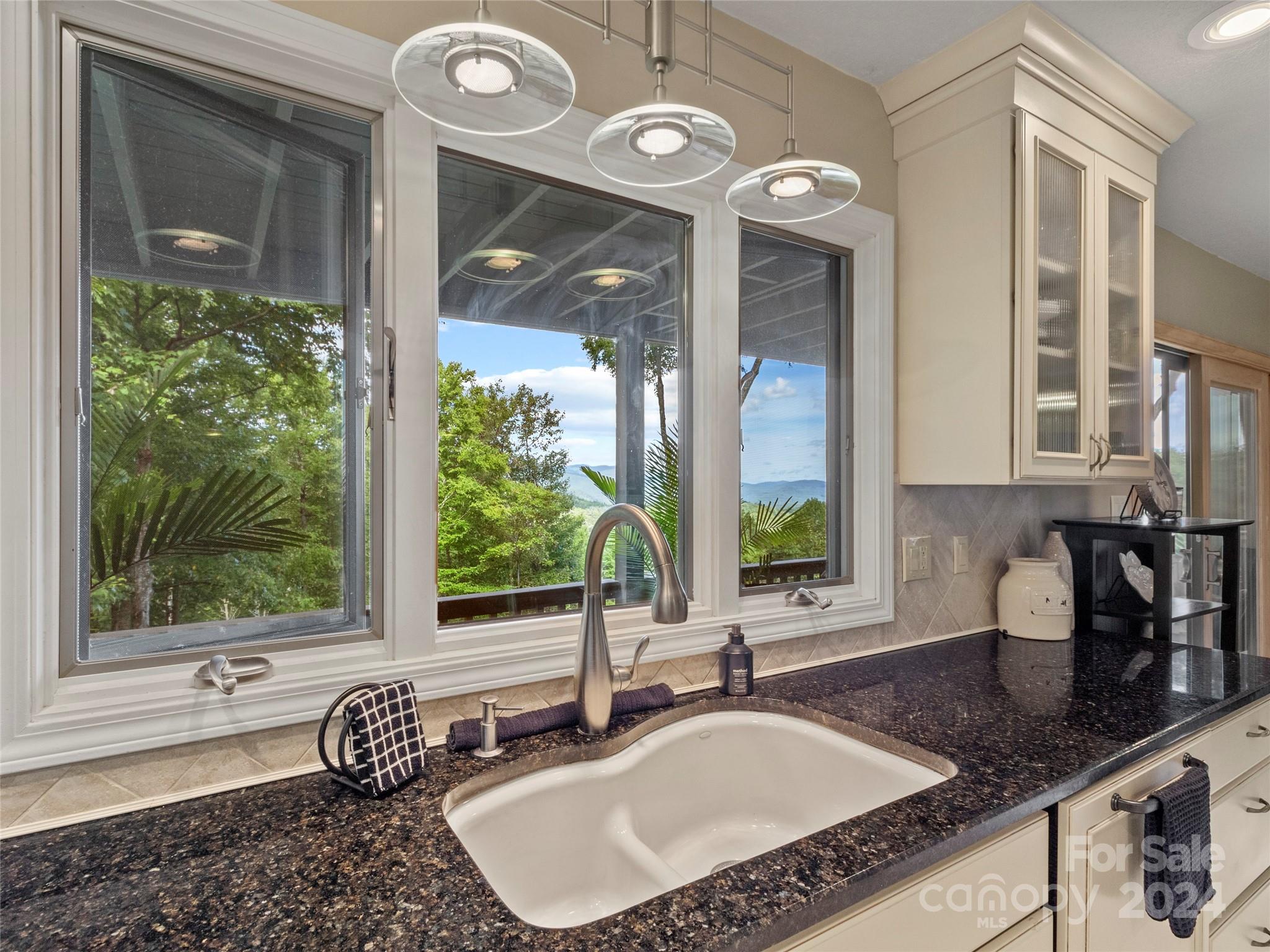 30 Pinkerton Corner Fairview, NC 28730 - Photo 10 of 31 a bathroom with a granite countertop sink and a large mirror