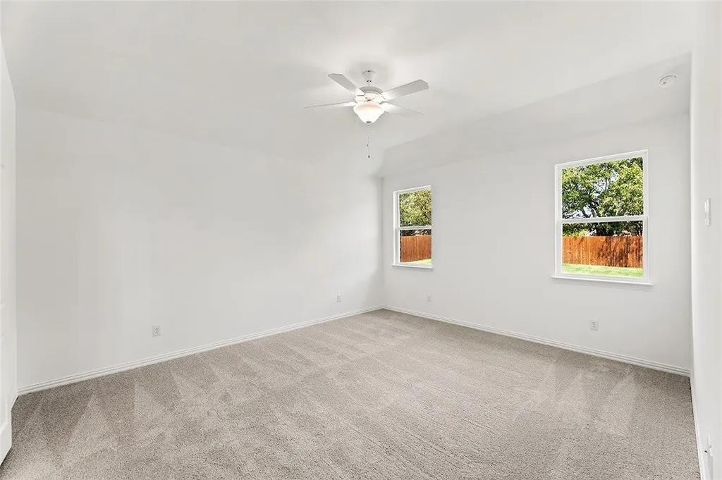 1632 Pavin Lane Fort Worth, TX 76052 - Photo 15 of 37 an empty room with a window and a fan