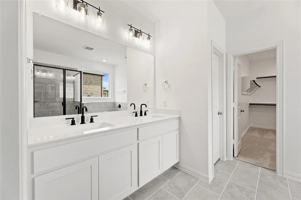 1632 Pavin Lane Fort Worth, TX 76052 - Photo 17 of 37 a bathroom with a sink and a mirror