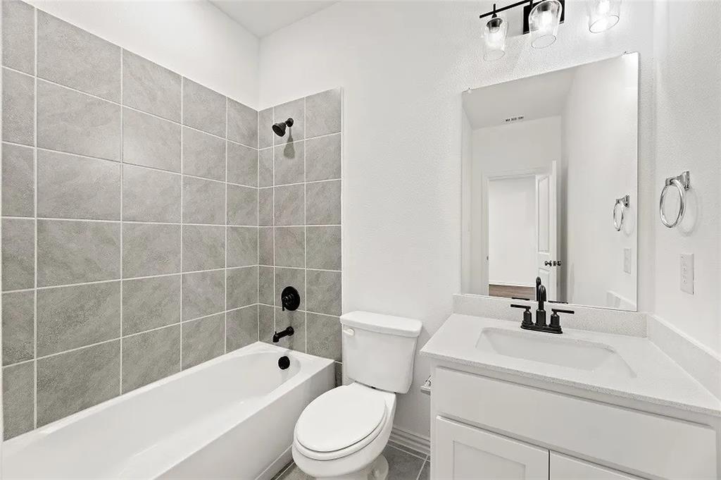 1632 Pavin Lane Fort Worth, TX 76052 - Photo 26 of 37 a bathroom with a sink a toilet and shower