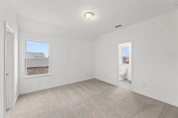 an empty room with a empty space and windows