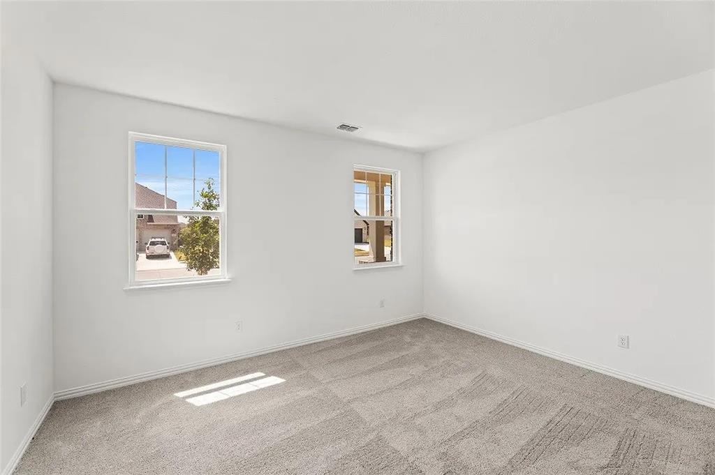 1632 Pavin Lane Fort Worth, TX 76052 - Photo 30 of 37 an empty room with windows