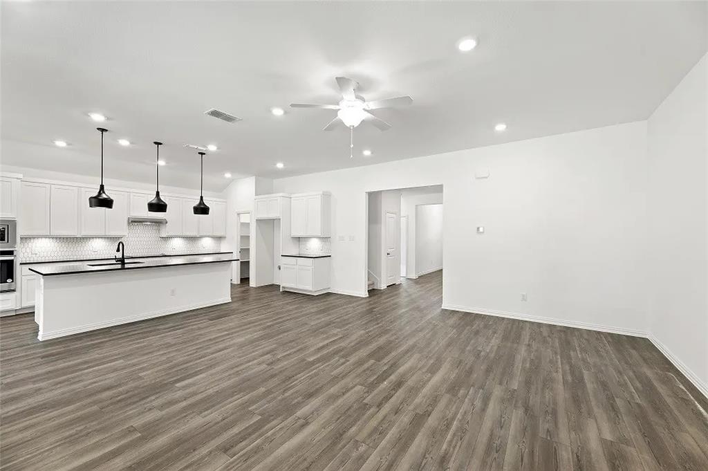 1632 Pavin Lane Fort Worth, TX 76052 - Photo 6 of 37 a large kitchen with a large counter top appliances and cabinets