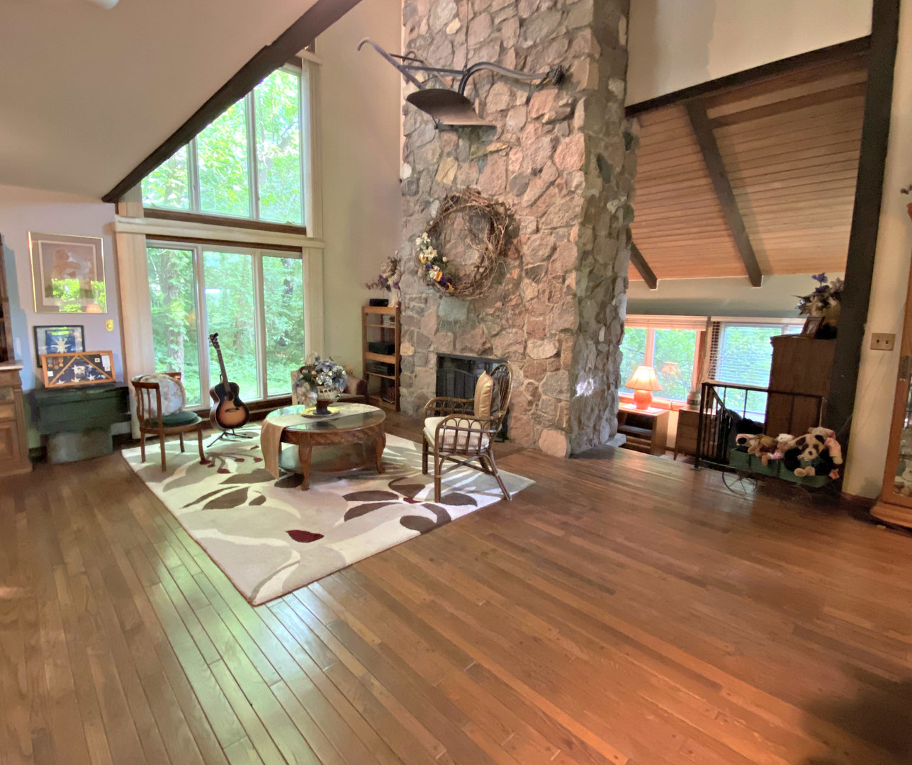 17301 O'Brien Road Harvard, IL 60033 - Photo 12 of 33 a view of a dining room with furniture a fireplace and wooden floor