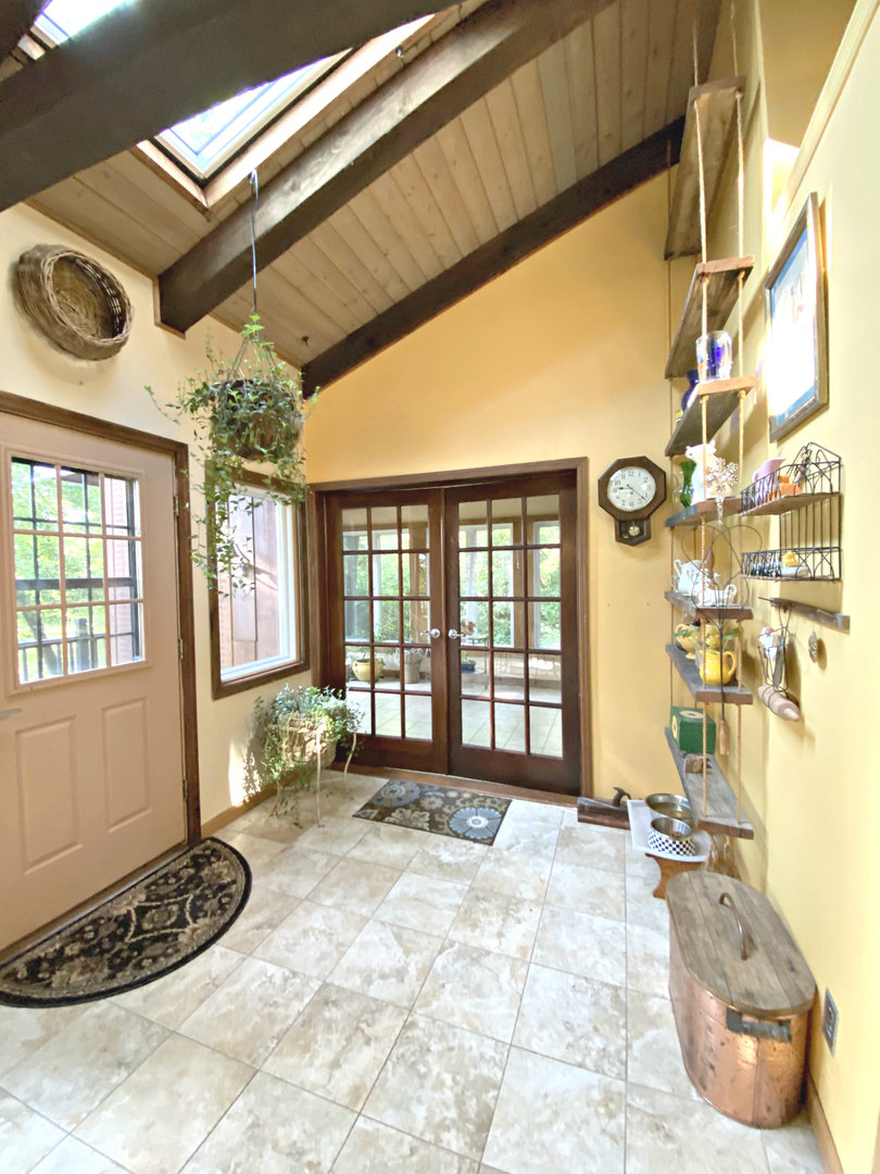 17301 O'Brien Road Harvard, IL 60033 - Photo 19 of 33 a spacious bathroom with a granite countertop tub and a large window