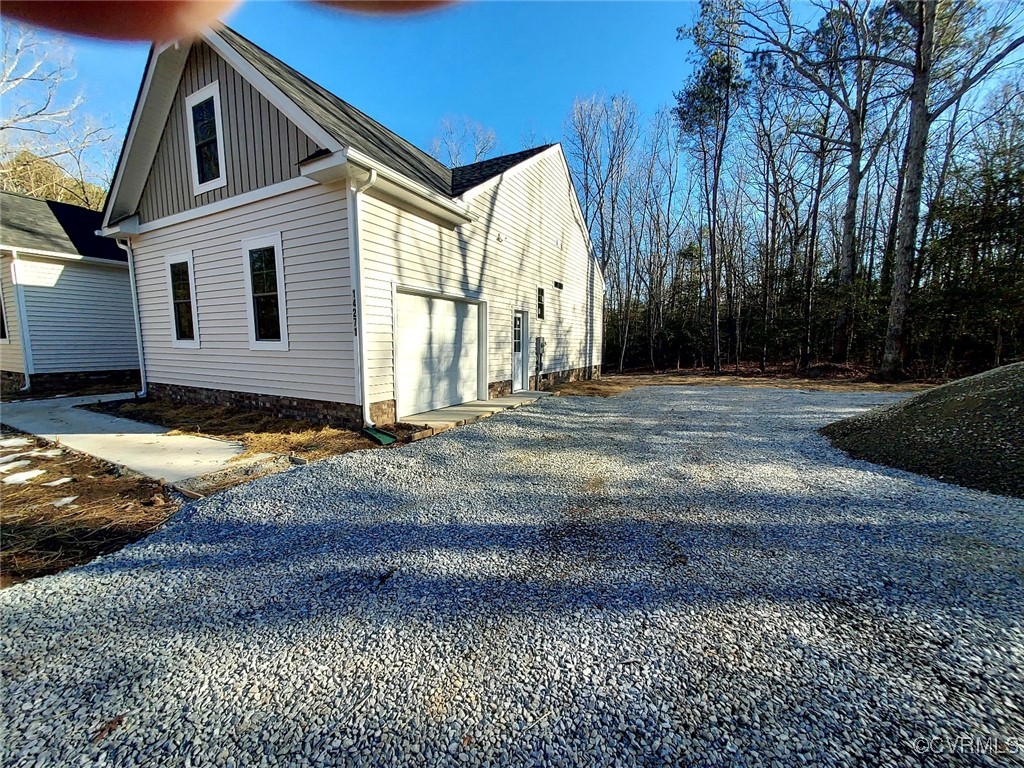 14271 Stage Road Lanexa, VA 23089 - Photo 8 of 14 View of side of property featuring a garage