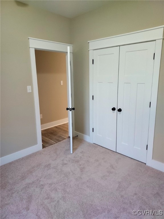 14271 Stage Road Lanexa, VA 23089 - Photo 10 of 14 Unfurnished bedroom with light carpet and a closet