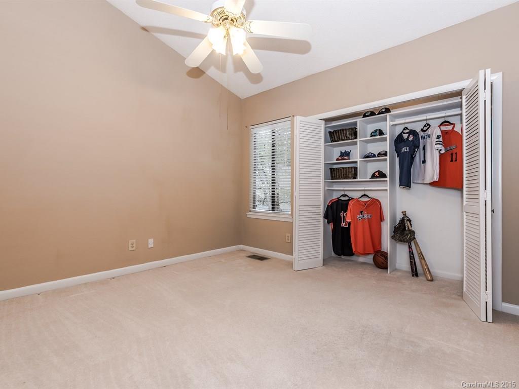 42 Old Post Road, Unit 42 Lake Wylie, SC 29710 - Photo 14 of 24 an empty room with closet and a chandelier fan