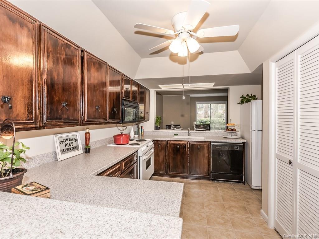 42 Old Post Road, Unit 42 Lake Wylie, SC 29710 - Photo 5 of 24 a view of a living room and kitchen with a stove