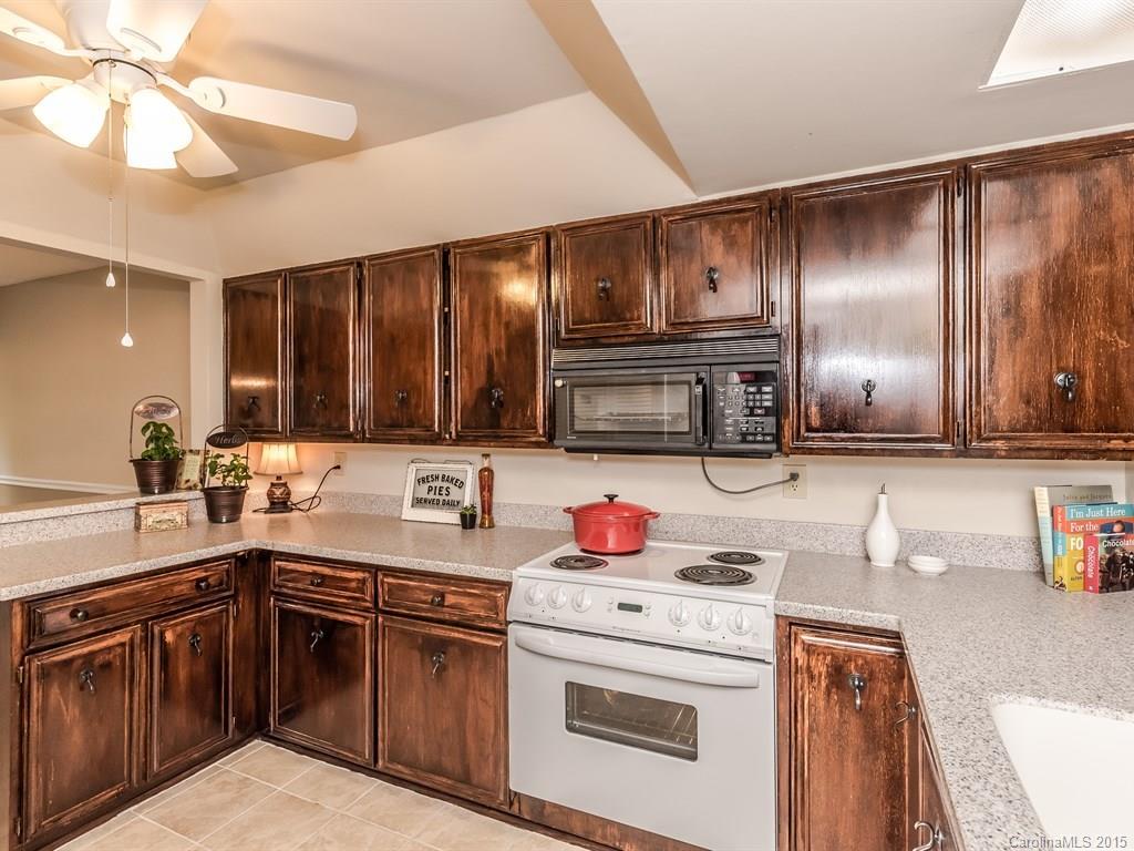 42 Old Post Road, Unit 42 Lake Wylie, SC 29710 - Photo 6 of 24 a kitchen with a sink stove and cabinets
