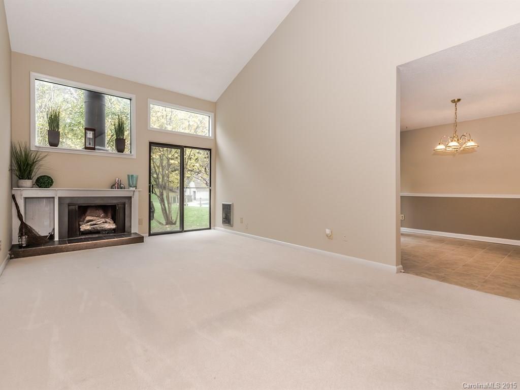 42 Old Post Road, Unit 42 Lake Wylie, SC 29710 - Photo 8 of 24 an empty room with fireplace and windows