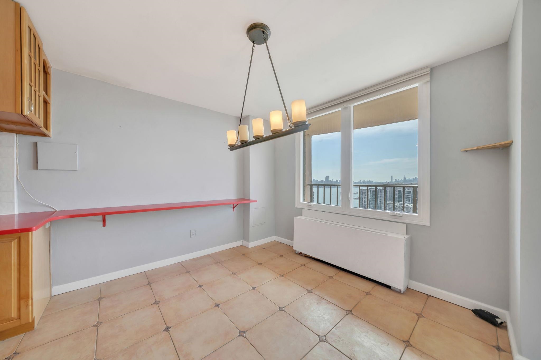 380 Mountain Road, Unit 213 Union City, NJ 07087 - Photo 11 of 36 a view of an empty room with a window